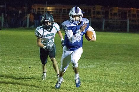 Mission Bulldog quarterback Isaac Dumontier pushes for a first down.