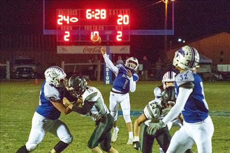 Mission Bulldog quarterback Kellen McClure connects with running back Layne Spidel for a second quarter touchdown.