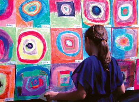 Jalyn Farmer enjoys the outdoor gallery setting at Linderman Elementary School’s “Arts in Our Backyard” event.  