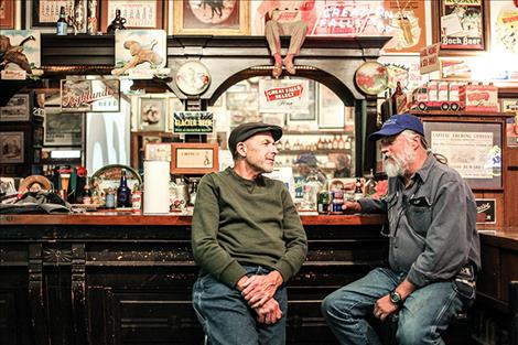 Jim Ereaux and Frank Tyro mingle at the hisotric bar at the beer museum.