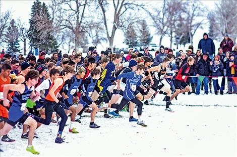 Boys run at the gun during the start of the Boys State B championship, despite chilly temps and snow.