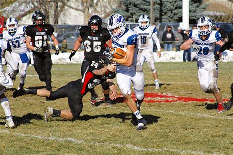 Troy Matt eludes the Panther defense for a 60-yard sprint to the end zone during Saturday's playoffs in Park City.