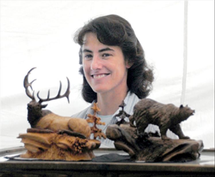 Joan Kosel displays wildlife carvings she creates. Kosel has been carving for 16 years.