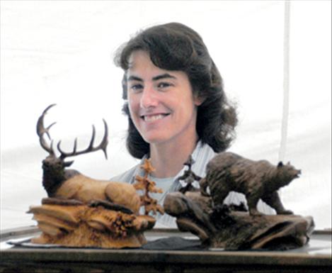 Joan Kosel displays wildlife carvings she creates. Kosel has been carving for 16 years.