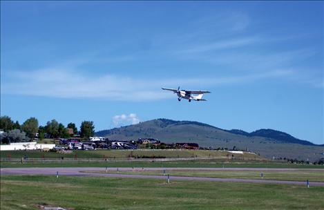 Pilot Nels Jensen takes off from Polson Airport with three boys. Saturday was windy and made flying a little choppy, but the Young Eagles loved it.