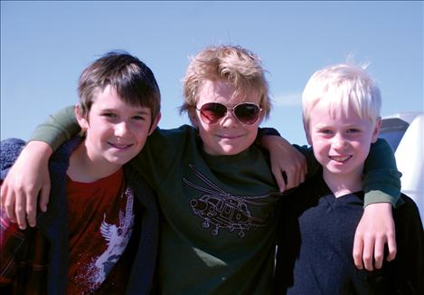 Dylan Wisniewski, Ethan McCauley and Sean Murphree enjoy their day at the Polson Airport.