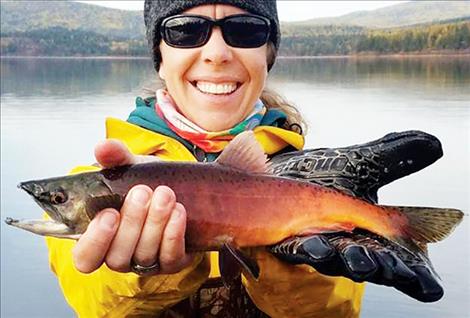 FWP Fish Culture Specialist Tricia Cycz holds a Kokanee Salmon.