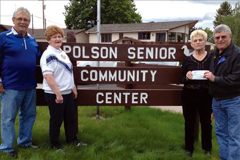 Sponsor Mark Beckley of Alpha Technologies presents a check in the amount of $1,524 to Kay Stam, Polson Senior Center treasurer and Dee Adams, Polson Senior Center president. Also pictured is Tracy Dooley, Farmers Insurance Agent.