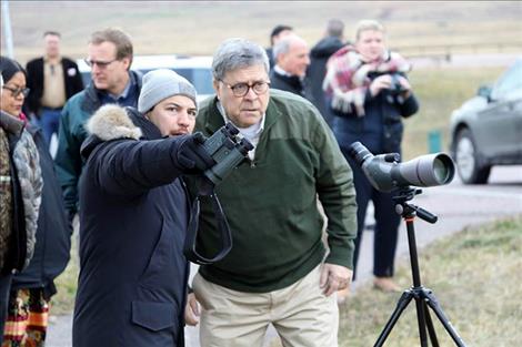 CSKT Attorney Shane Morigeau points out bison in the distance for United States Attorney General William Barr.