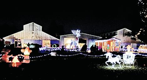 A reindeer, flanked by Santa’s house and millions of lights, shines on the Lake County Fairgrounds during Lights Under the Big Sky in 2018.