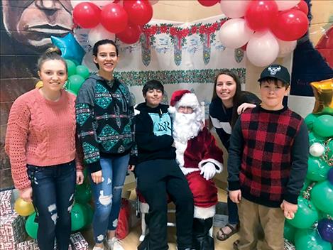 Children enjoy a visit with Santa Claus.