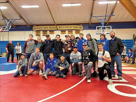 The Mission/Charlo wrestlers proudly pose for a photo after a second-place team finish at the Bob Kinney Classic.