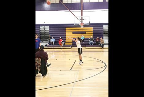 Spectators watch free throws at the Elks Hoop Shoot.