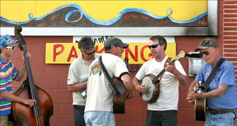 Bluegrass tunes by the Gravely Mountain Boys provided background music for Wednesday’s opening of the Arlee Farmers Market.