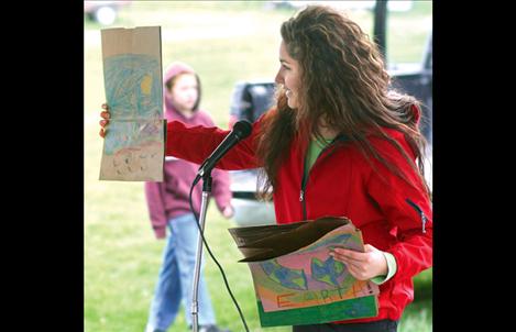 Camaleigh Old Coyote helps out with an Earth Day event in April and will join her peers as they travel to Cambodia.