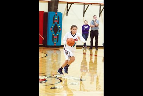 Lady Eagle Viviana After-Buffalo Adams brings the ball down court. 