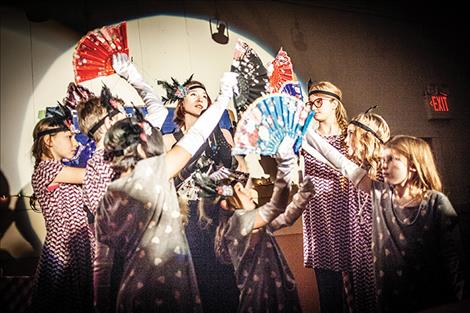 Katherine Smith as Tallulah, sings a colorful song with her entourage dancing in the Speakeasy.