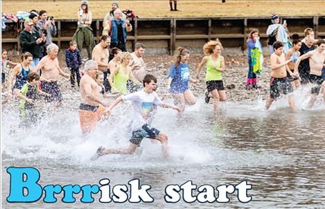 Chill seekers make a splash into the first day of 2020 during the 22nd Annual Polson Polar Plunge. 