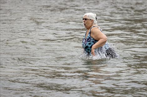 One of about 40 participants takes a cold plunge. 