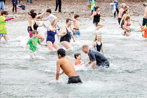 Plungers  celebrate  the New  Year with  a cold dip  in Flathead  Lake.  