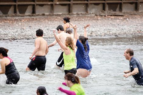 Plungers celebrate the New Year with  a cold dip  in Flathead  Lake.  