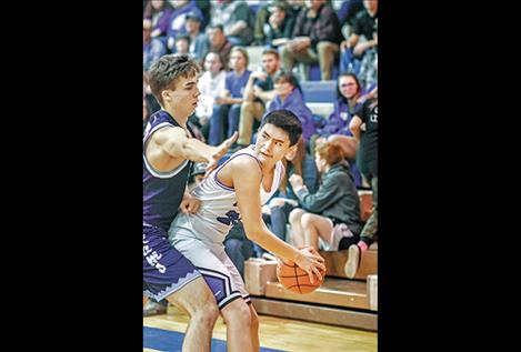 Davien Adams holds off Loyola during the Tuesday game.