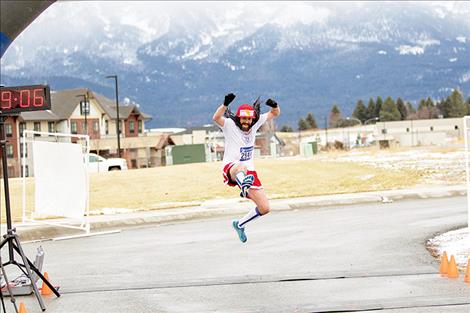 Jason Delaney finishes the Sorry ‘Bout That half marathon after running at a six-minute-mile pace for one hour and 19 minutes.