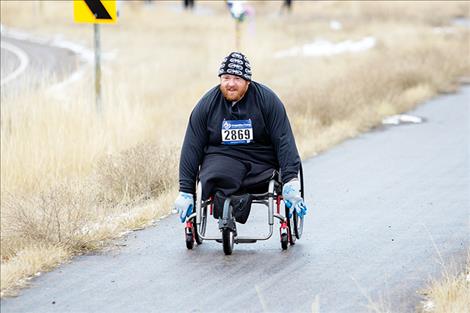 Tom Parker, number 2869, makes his way  along the course.