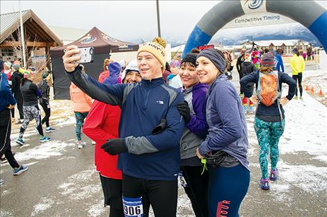 A group of runners gather for a pre-race photo.