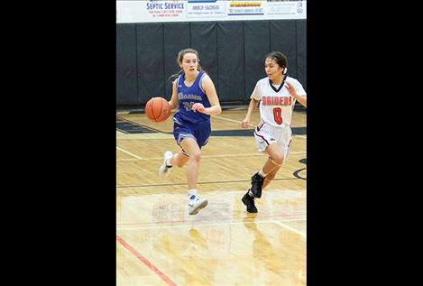 Lady Bulldog Sydney Brander brings the ball down the court