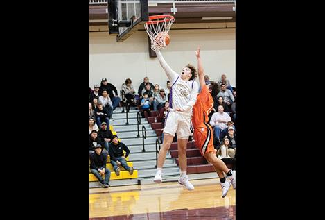 Polson Pirate Colton Graham lays it up for a score.