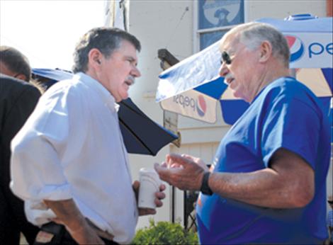 U.S. Senate candidate Dennis Rehberg visits with Mauri Morin during a campaign stop in Polson.