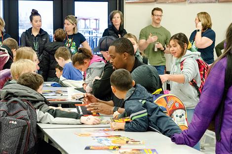 K. William Harvey Elementary School students read books with police officers on Friday morning.