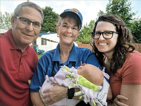 David, Marcia, Jessica smile with newborn Claire in 2019. 