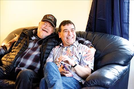 Lake County Judge James Manley and Scoobie’s House developer Jay Brewer sit on a couch in the home during the open house to celebrate the project. 