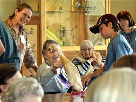 Philip Vaughan shares his Indian Runner duck with residents and staff of St. Luke Extended Care Facility Thursday, June 13.