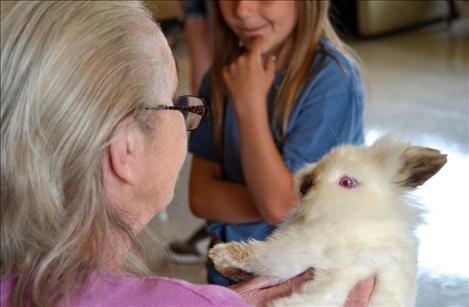 Megan Evelo shares her bunny, "Prince," with Jackie Knapp.