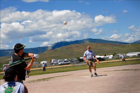 Finley Point Fire Department firefighter Brent Burland prepares to swing at a fat pitch.