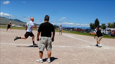 Nate Lundeen, Lake County Sheriff’s Office, runs for home after he batted in three runs during the Battle of the Badge softball tournament.