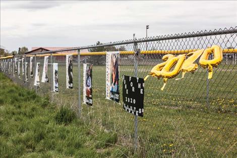 Ronan High School senior banners decorate the fence along U.S. Highway 93 in Ronan.