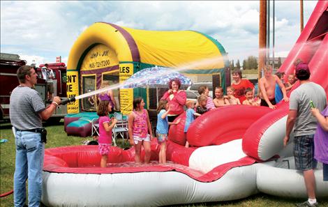 An inflatable slide and jump house provided entertainment for the young crowd.
