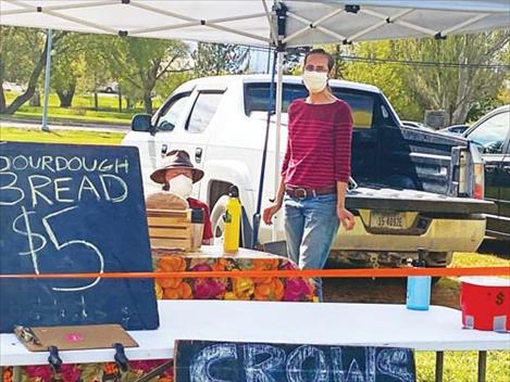 Zach Johnson and Brianna Ewert of Crows View Organic Farms display their fresh-baked bread.