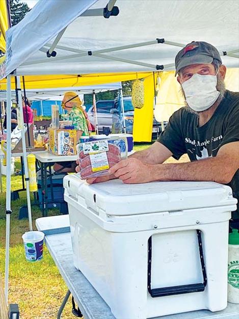 David Sturman sells hay fed products at the market.