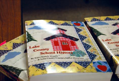 A hand quilted design by Kate Ike graces the cover of both volumes of the Lake County School History books. 