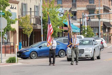 Polson VFW members Matt Lee and Denny Lockwood march down Main Street in Polson on Memorial Day.