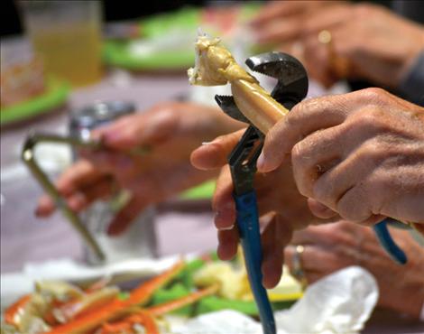 Participants were advised to bring their own utensil to crack crab, and a variety of tools did the job.