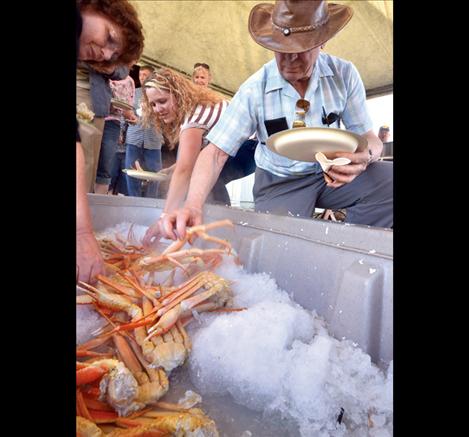 Alaskan Snow Crab legs disappear as fast as participants can grab them from the cooling trough.