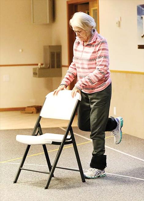  Dutton resident Alice Sutherland, 77, focuses as she does leg-lifting exercises during the fall session of the StrongPeople program in Choteau.