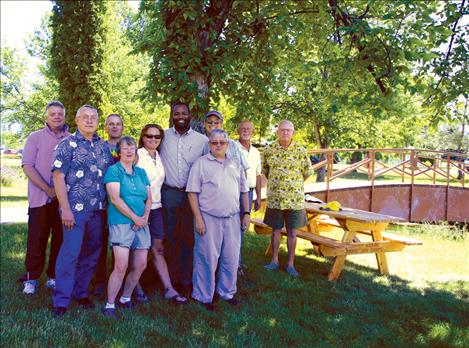 Mark McDonald, left, Bob Gauthier, Mark Nelson, Mary Stranahan, Jennifer Rolfness, Andy Holmlund, Tom McDonald, Larry Hall, Bob Culp and Don Olsson, Jr., gather at Bockman Park to pledge their support for the park.