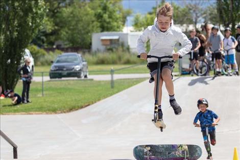  A scooter rider preforms a jump trick